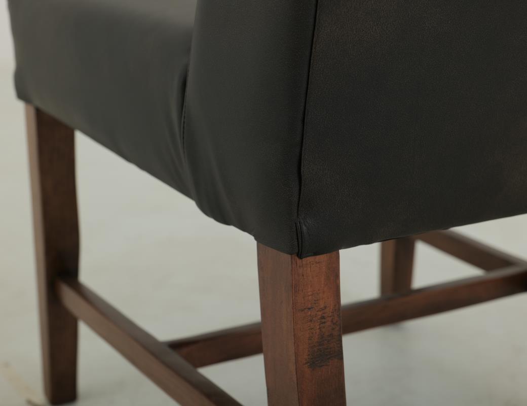 Wooden frame, upholstered chair with a high backrest.